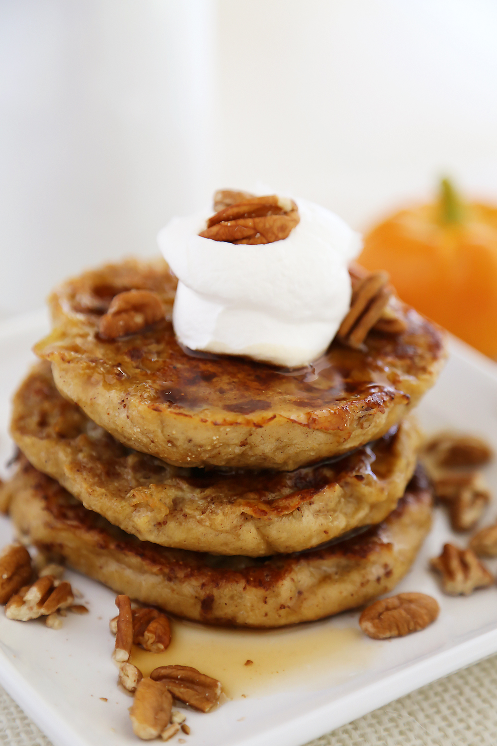 Pumpkin Vanilla English Muffin French Toast - Fluffy, buttery French toast made with pumpkin spice English muffins, vanilla, cinnamon and nutmeg! Thecomfortofcooking.com